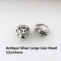 Detailed macro view of 12x14mm antique silver lion head charm bead for DIY bracelets - Antique Silver Lion Head