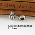 Detailed macro view of 9x12mm antique silver lion head charms with crown for jewelry making - Antique Silver Crowned Monkey Head