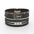Detail of vintage leather wrap bracelet featuring Tree of Life charm and engraved quotes - Black