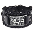 Macro detail of wide black leather bracelet with embossed fox metal plate and woven texture - Genuine Leather Antique Silver