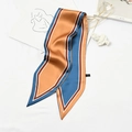 Elegant striped skinny silk scarf in orange and blue tones tied on a bag as accessory - Color Block Yellow Blue
