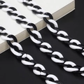 Minimalist black and white acrylic eyewear chain with bold resin links in a retro style - Black and White Patchwork