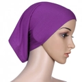 Detail view of purple mercerized cotton stretch turban cap on a mannequin - Purple