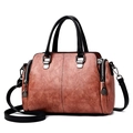 Brown litchi texture PU leather boston handbag for women with black handles and shoulder strap - Dusty Pink