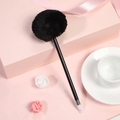 Elegant black ballpoint pen featuring a fluffy black pom pom topper on a pink gift background - Black (Pom Pom)