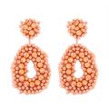 Handmade orange and pink beaded drop earrings in a bohemian waterdrop design - Orange