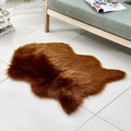Irregular brown faux fur area rug with long plush texture on white tiled floor - Irregular Coffee