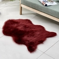 Faux fur rug in deep red color with irregular animal shape and long plush texture for home - Irregular Wine Red