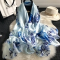 Elegant light blue silk scarf with floral print and white sun hat on a faux fur background - 90*180cm / Blue