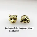 Detail view of 11x12mm antique gold leopard head metal beads for DIY jewelry making - Antique Gold Leopard Head