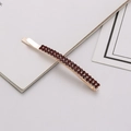 Detailed macro view of gold hair clip featuring double-row deep red rhinestones - Dark Red