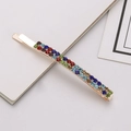 Detailed view of golden hairpin with three rows of multi-colored sparkling rhinestones - Rainbow