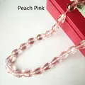 Macro detail of faceted water-red teardrop glass beads for DIY jewelry making - 4*6mm / Rose Red