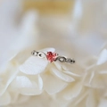 Silver-plated heart ring with pink zircon and infinity band on white petals - Platinum Plated Red Zirconia