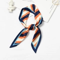 Navy blue and orange striped silk scarf tied in a bow with minimalist aesthetic props - Tri-Color Diagonal Stripes Navy Edge
