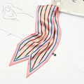 Pink silk neck scarf with chain pattern and 100% silk label on a white background - Narrow Buckle Pink
