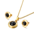 Parure dorée avec cristaux noirs ronds comprenant un collier et des boucles d'oreilles - Noir