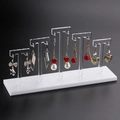 Acrylic earring display stand with white base and five transparent T-shaped hanging rods - White