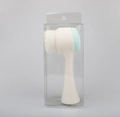 Dual-sided manual facial cleansing brush in mint green and white with clear packaging - Dot/Transparent Packaging / Blue