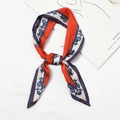 Silk feel small square scarf featuring orange and blue chain star pattern in bow tie shape - Chain Grid Red