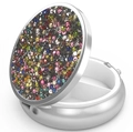 Macro detail of round metal pill box with colorful rhinestones and two-compartment interior - Silver - Silver Multi-color Rhinestone