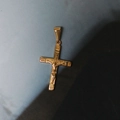 Close-up of golden 18K gold-plated titanium steel crucifix cross pendant with Jesus relief - Gold Cross