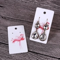 Vintage teardrop crystal earrings on a white flamingo jewelry display card with wood background - 4.5x8.5cm Flamingo Display Card