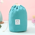 Sky blue velvet drawstring cosmetic bag in cylindrical shape for travel storage - Blue