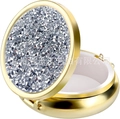 Macro detail of portable round gold pill box with diamond texture and three internal dividers - Gold-White Zircon