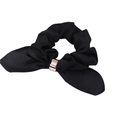 Close-up of black satin hair scrunchie with rabbit ear bow and rose gold metal ring - Black