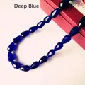 Macro shot of faceted deep blue teardrop crystal beads for jewelry making accessories - 4*6mm / Dark Blue