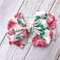 Close-up of white floral baby headband with pink roses and large knotted bow detail - Pink Flower