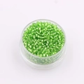 Green glass seed beads for DIY jewelry making in a transparent round plastic container - Light Green