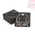 Star-shaped rhinestone stud earrings with silver finish on a round black display card - EA-ZK012 5x5cm Black Gold Foil Circle