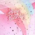 Pink double-layer acrylic Happy Birthday cake topper over a starry rainbow background - Pink