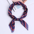 Silky navy blue neck scarf with red and white diagonal stripes in a knotted style - Navy Blue Plaid