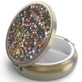 Close-up of portable round metal pill box with colorful rhinestones and two compartments - Bronze - Silver Multi-color Rhinestone