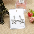 Star-shaped rhinestone drop earrings in silver finish on a white display card - 5x7cm Random English Text