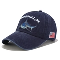 Close-up of shark embroidery and American flag patch on washed denim baseball cap - Adjustable / Navy Blue