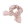 Detail of pink satin scrunchie featuring a rabbit ear bow and golden metal ring accent - Beige
