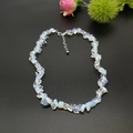 Macro shot of irregular natural white crystal shards on a necklace with silver clasp - Bracelet / Opal