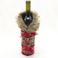 Close-up of Christmas wine bottle cover with red plaid fabric and faux fur collar detail - Red Plaid