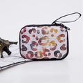Mini suitcase coin purse with watercolor leopard print and black wrist strap on desk - Multi-color Watercolor Leopard (3)