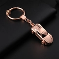 Rose gold sports car keychain made of polished metal with stylish LED car charm - Gold