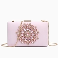 Pink evening clutch bag featuring crystal flower design and detachable gold chain strap - Pink