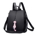 Minimalist black nylon backpack with a pink cat heart pendant for casual travel - Black
