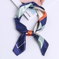 Satin silk scarf with navy and mint geometric pattern tied on a minimalist background - Navy Blue Color Block