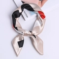 Square satin scarf with geometric pattern in red and beige, tied as an elegant necktie - Beige Color Block