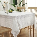 Nordic vintage white cotton lace tablecloth with hollow floral patterns on a wooden table - White Clover Edging
