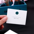 White cardboard jewelry display card with hanging hole and black lettering for earrings - EA-ZK021 8x6cm White JE Made in China
